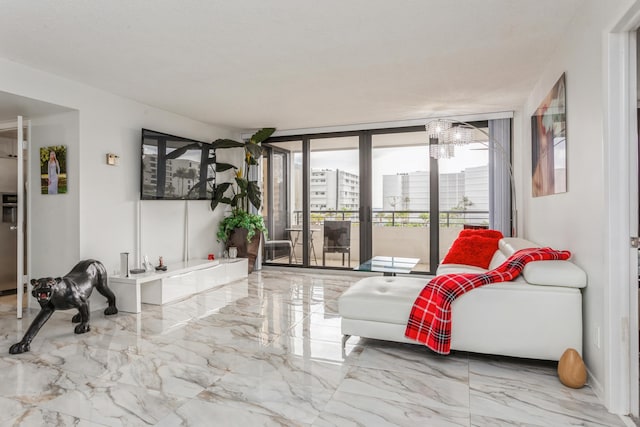 living room with a chandelier and floor to ceiling windows