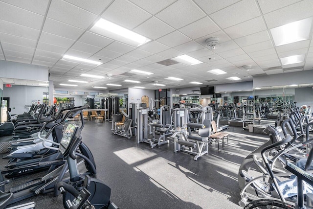 exercise room featuring a drop ceiling