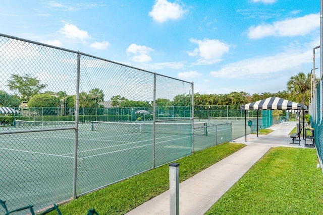 view of tennis court with fence