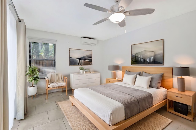 bedroom featuring a wall mounted air conditioner, light tile patterned flooring, and a ceiling fan