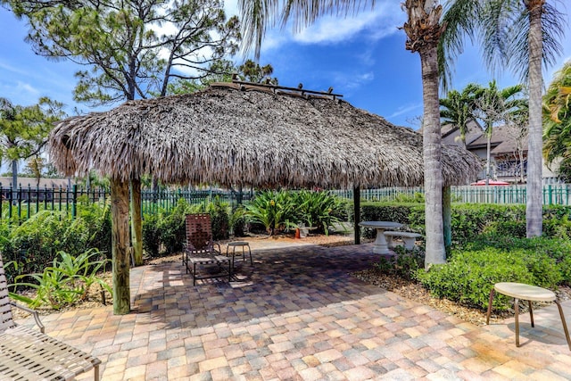 view of patio / terrace with fence and a gazebo