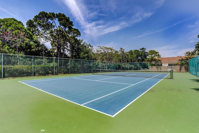 view of sport court with fence