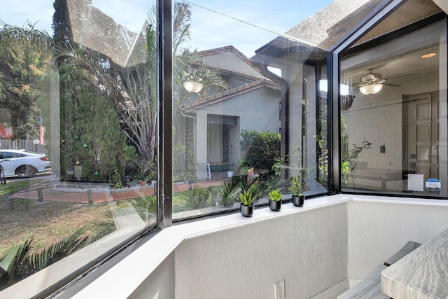 exterior space with plenty of natural light and ceiling fan