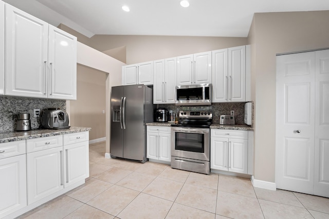 kitchen featuring white cabinetry, appliances with stainless steel finishes, and light tile patterned flooring