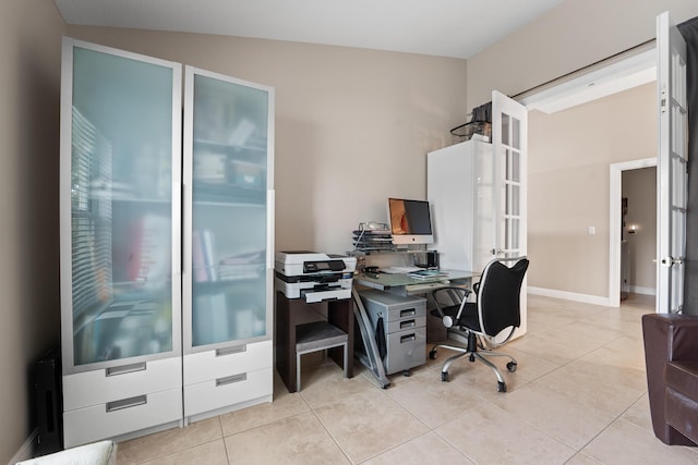 office area with light tile patterned floors, baseboards, and french doors