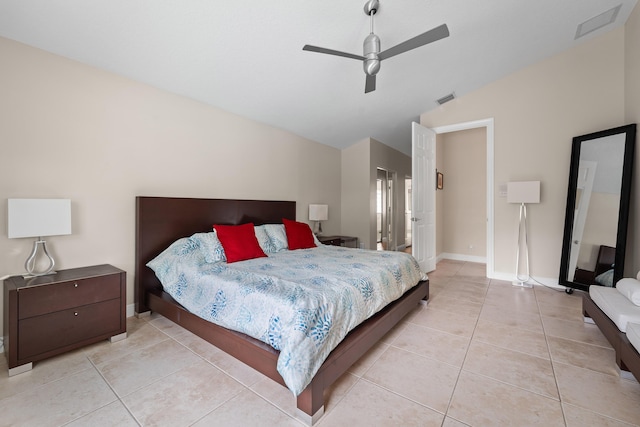 bedroom featuring light tile patterned floors, a ceiling fan, visible vents, vaulted ceiling, and baseboards