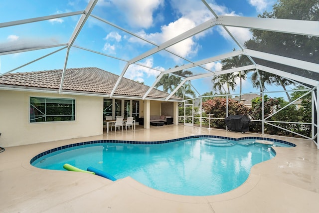 outdoor pool featuring an outdoor hangout area, a patio, area for grilling, and a lanai