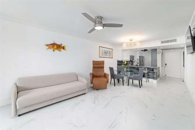 living room with marble finish floor, visible vents, ornamental molding, ceiling fan, and baseboards