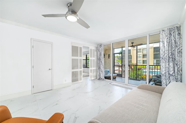 living room with marble finish floor, floor to ceiling windows, crown molding, and baseboards