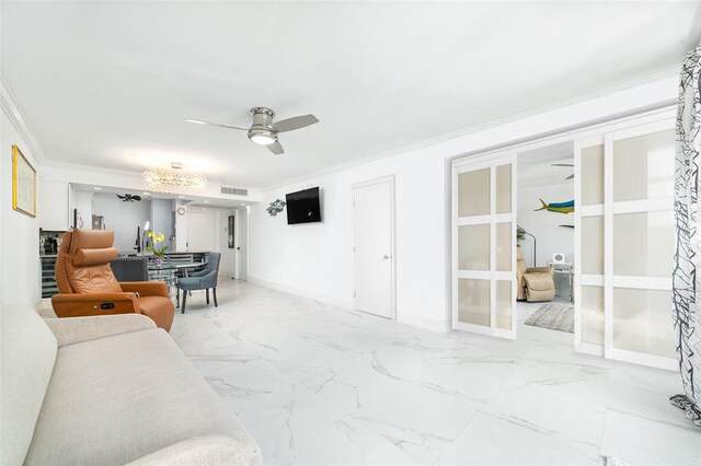 living room with marble finish floor, visible vents, ornamental molding, ceiling fan, and baseboards