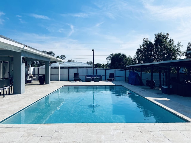 view of swimming pool featuring a fenced backyard, a fenced in pool, and a patio