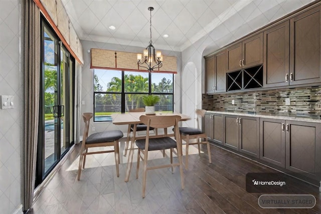 dining space featuring recessed lighting and a notable chandelier