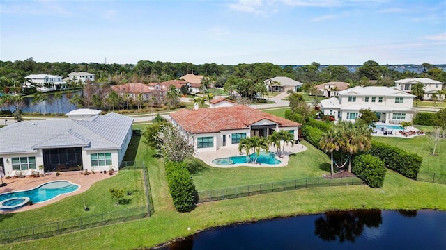 aerial view featuring a residential view and a water view