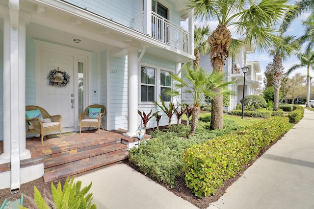 doorway to property with covered porch