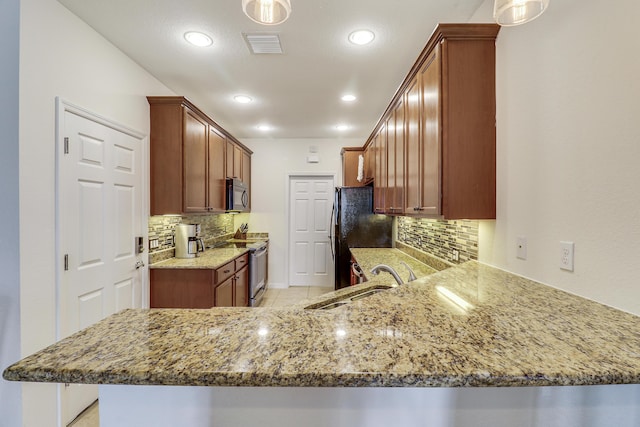 kitchen featuring sink, backsplash, black appliances, kitchen peninsula, and light stone countertops