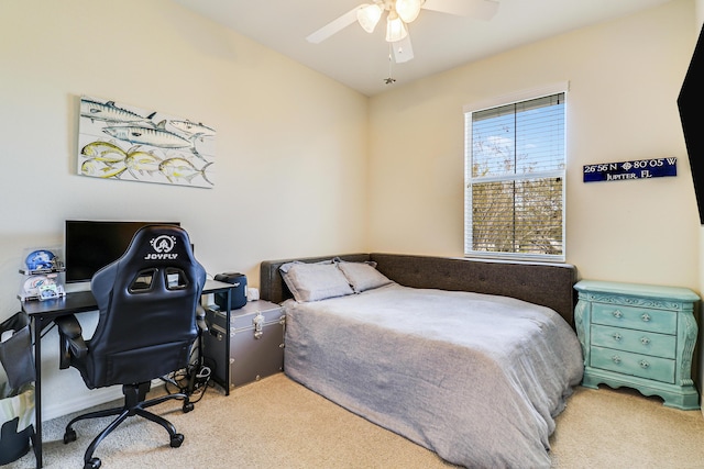 bedroom with ceiling fan and light colored carpet