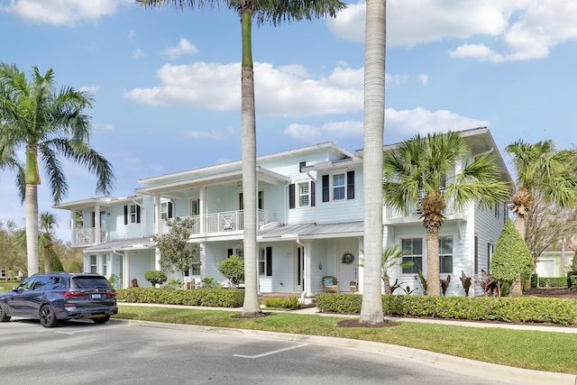 view of front of home with a balcony