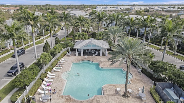 view of pool featuring an outbuilding and a patio area