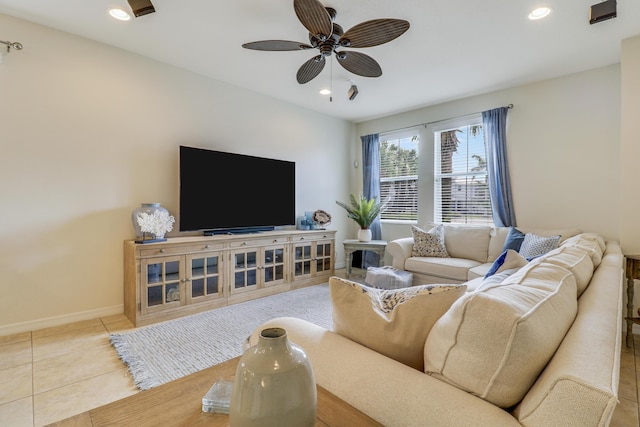 living room with tile patterned floors and ceiling fan