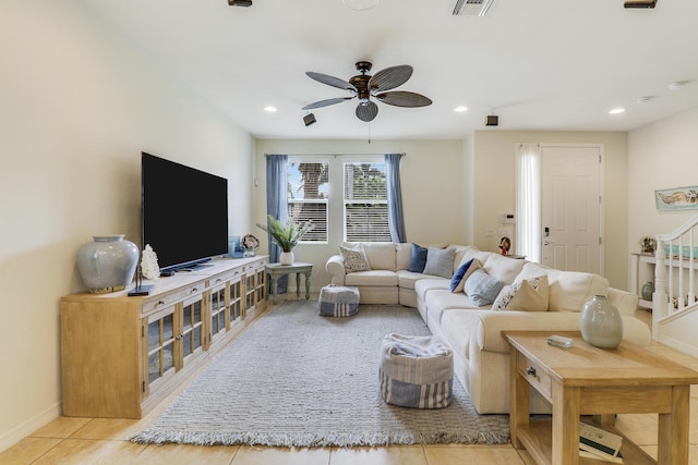 living room with ceiling fan and light tile patterned floors