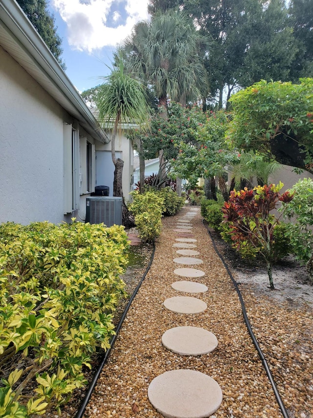 view of yard featuring central AC unit