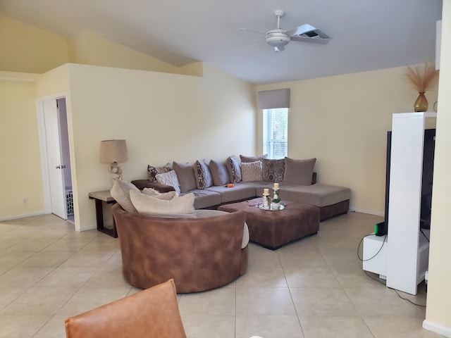 living room featuring lofted ceiling, light tile patterned flooring, and ceiling fan