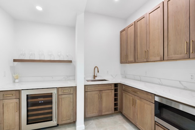 bar with beverage cooler, stainless steel microwave, wet bar, a sink, and recessed lighting