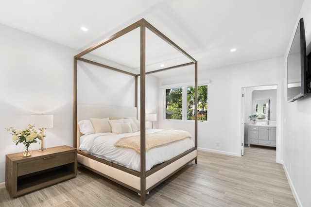 bedroom featuring recessed lighting, light wood-style flooring, and baseboards