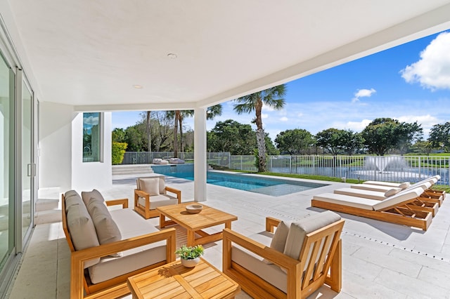 exterior space with a fenced in pool, a fenced backyard, a water view, a patio area, and an outdoor living space