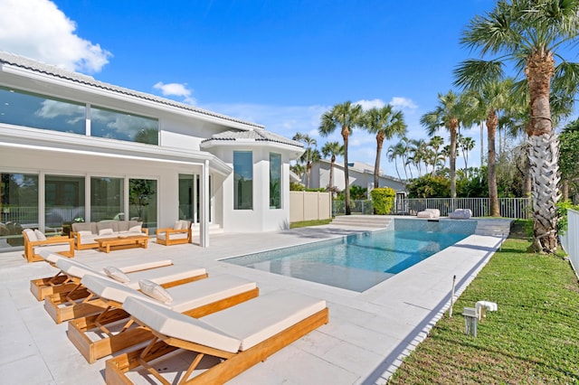 view of pool featuring a fenced backyard, outdoor lounge area, a fenced in pool, and a patio