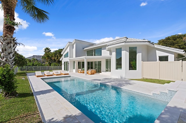 back of house featuring fence, a patio, an outdoor living space, and stucco siding