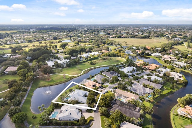 bird's eye view featuring a water view and a residential view