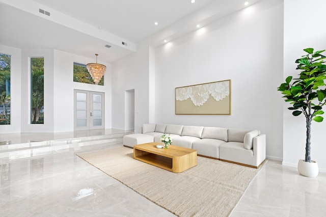 living room with visible vents, marble finish floor, a high ceiling, french doors, and recessed lighting