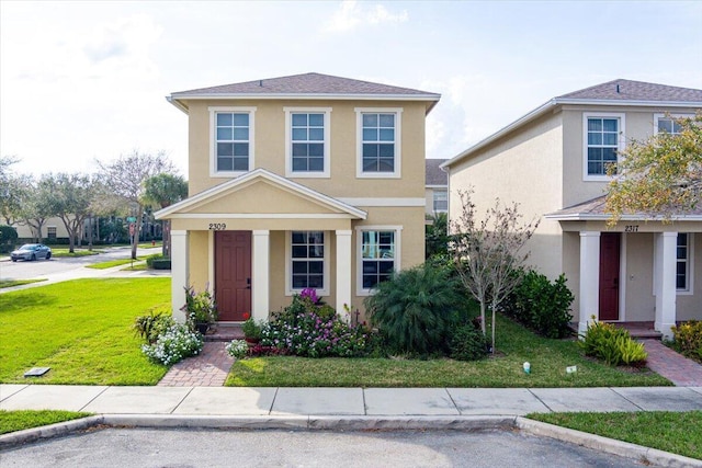 front facade with a front yard