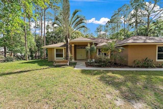 view of front of property with a front lawn