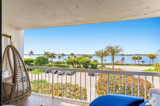 balcony featuring a water view