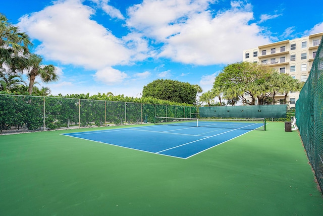 view of sport court with fence