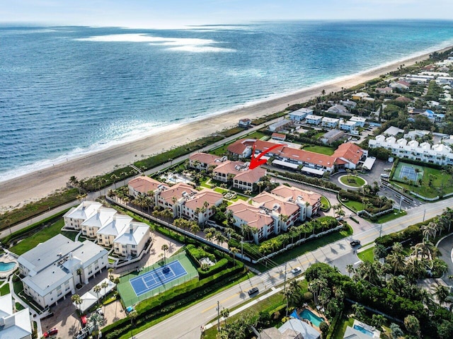 aerial view featuring a water view and a view of the beach