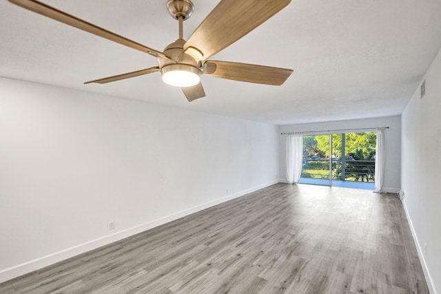 unfurnished room with a ceiling fan, baseboards, visible vents, and light wood finished floors