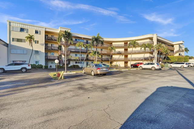 view of property featuring uncovered parking