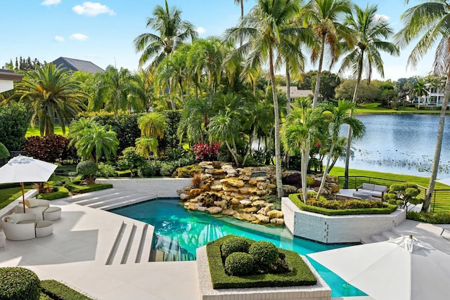 pool with a water view and a patio