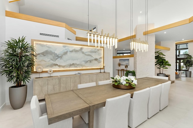 dining area featuring a high ceiling
