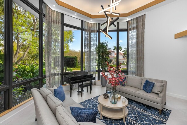 living area with recessed lighting, wallpapered walls, a towering ceiling, and tile patterned floors