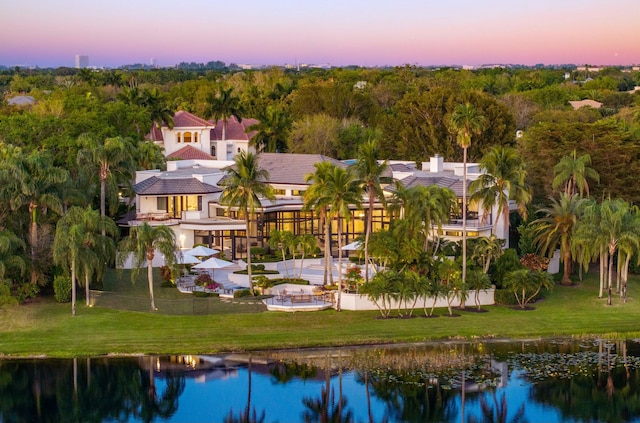 birds eye view of property with a water view