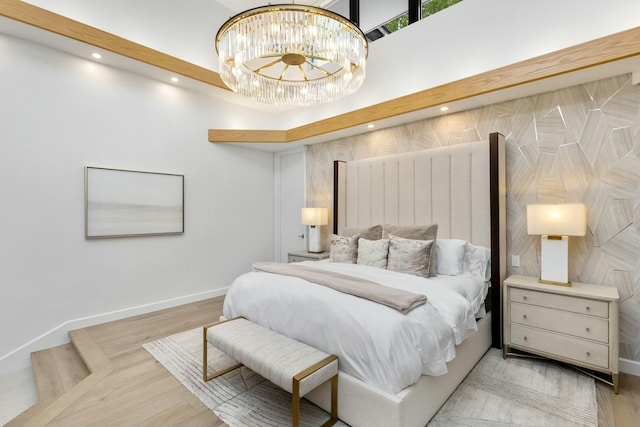 bedroom with recessed lighting, a notable chandelier, baseboards, and wood finished floors