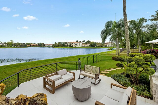 view of patio / terrace featuring a water view and an outdoor hangout area