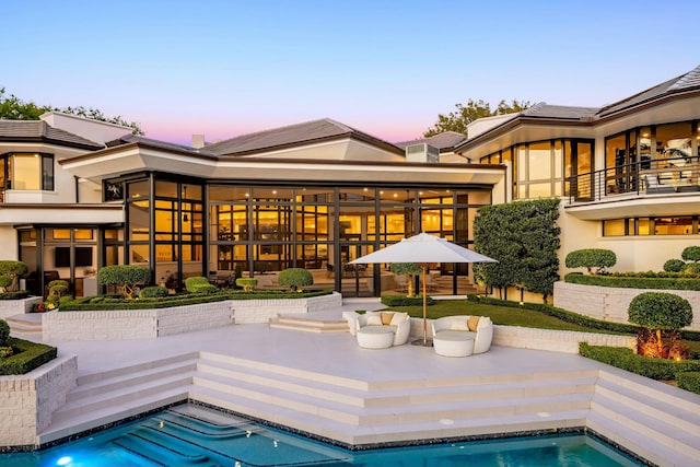 outdoor pool featuring a patio area