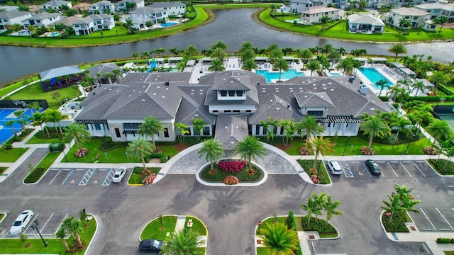 bird's eye view featuring a water view and a residential view