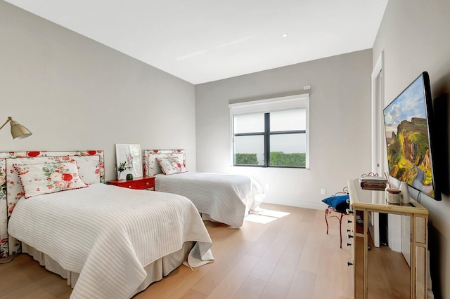 bedroom with light wood-type flooring