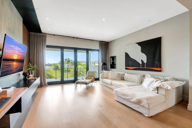 living room featuring recessed lighting and wood finished floors